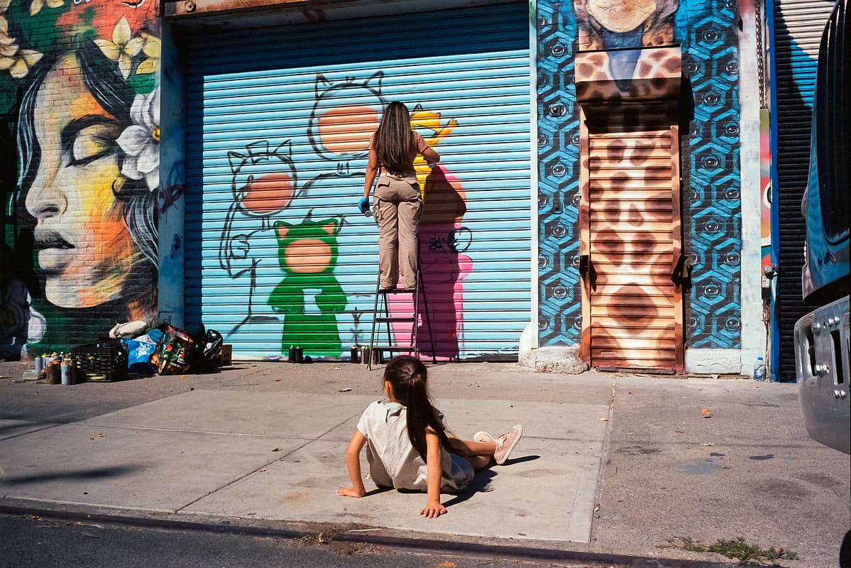 Mural artist and her audience