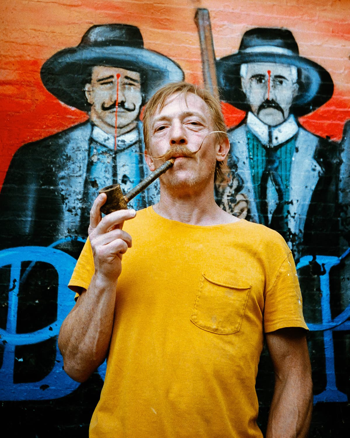 Pipe smoker at the cowboy mural