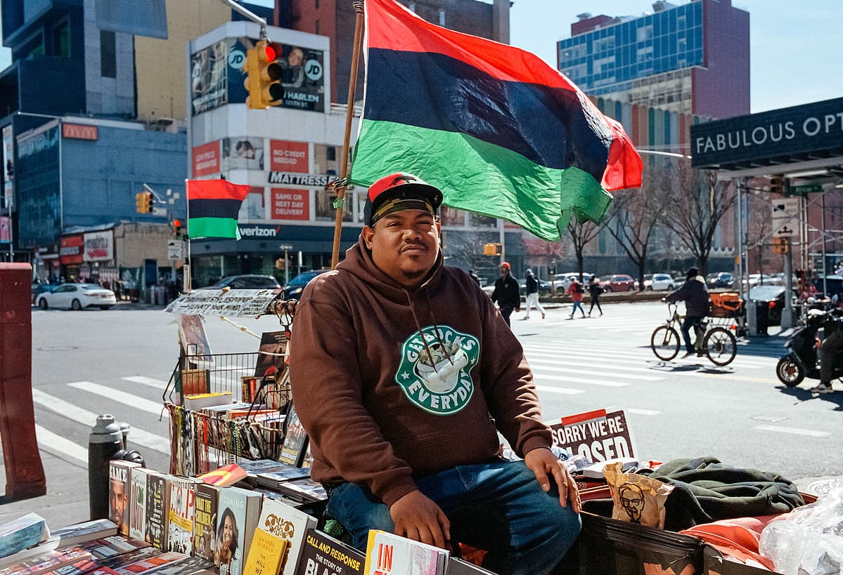 Book vendor, 125th Street